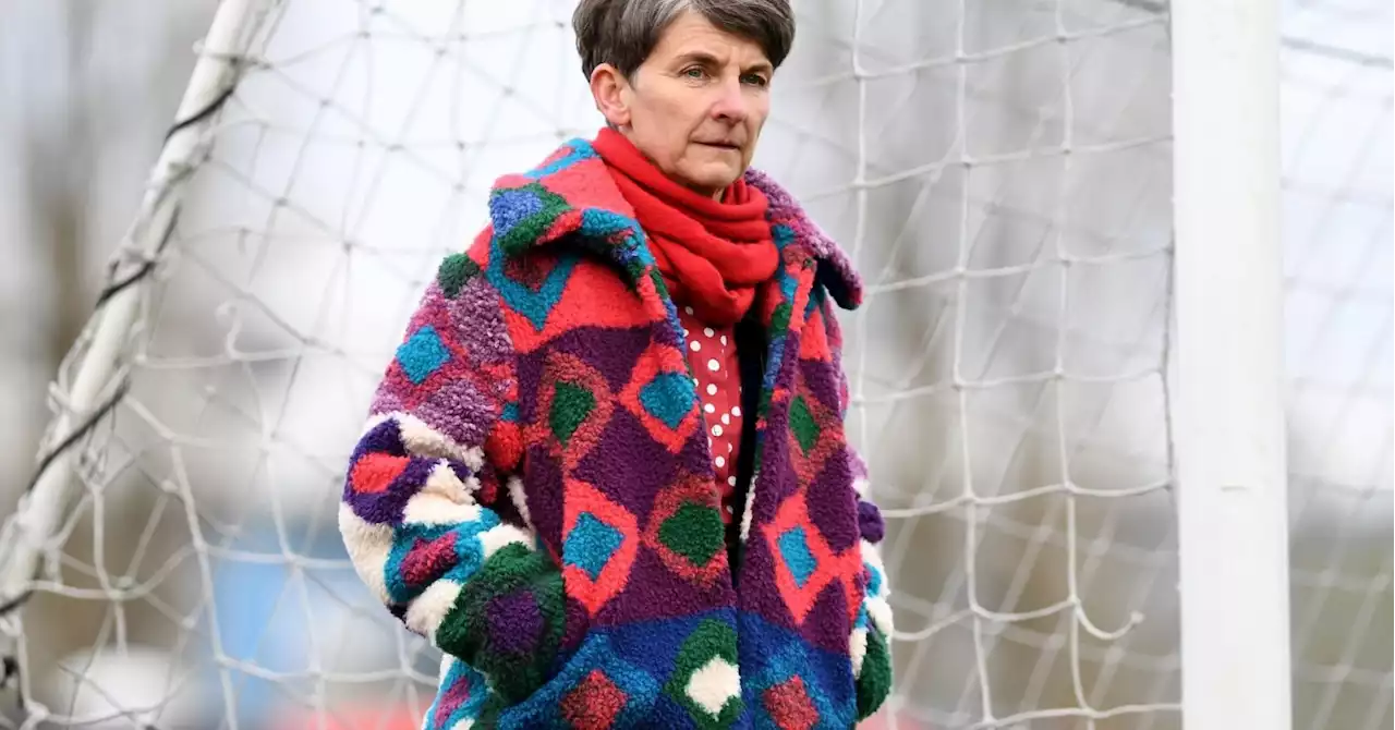 A former Wales football captain was told to remove her rainbow hat at the World Cup