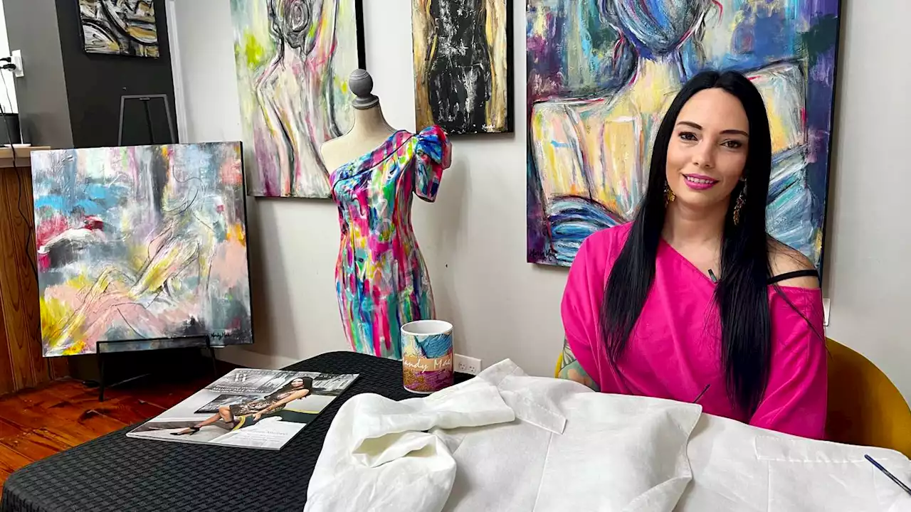 Artist’s hand-painted dress to match her work goes viral