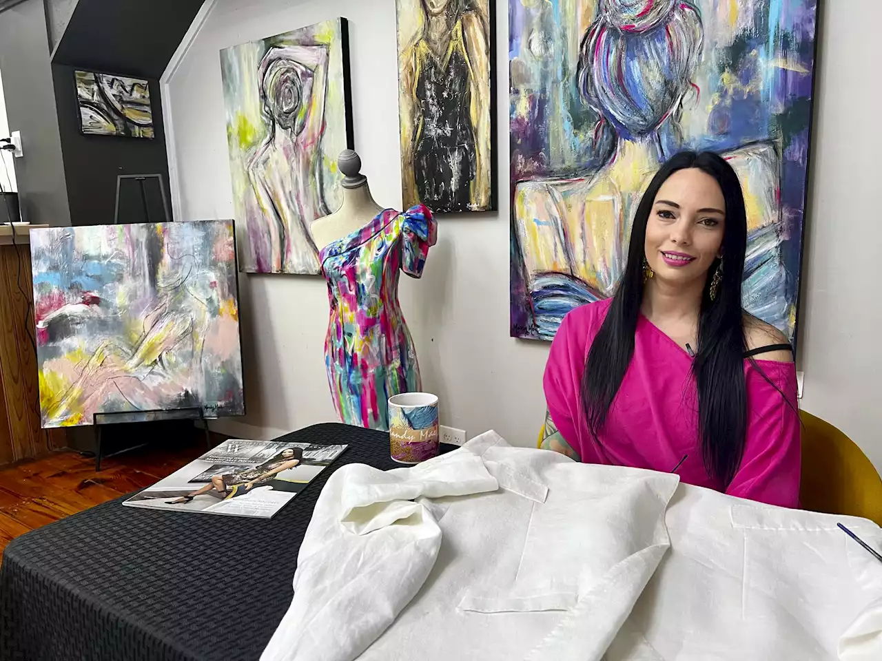 Artist’s hand-painted dress to match her work goes viral