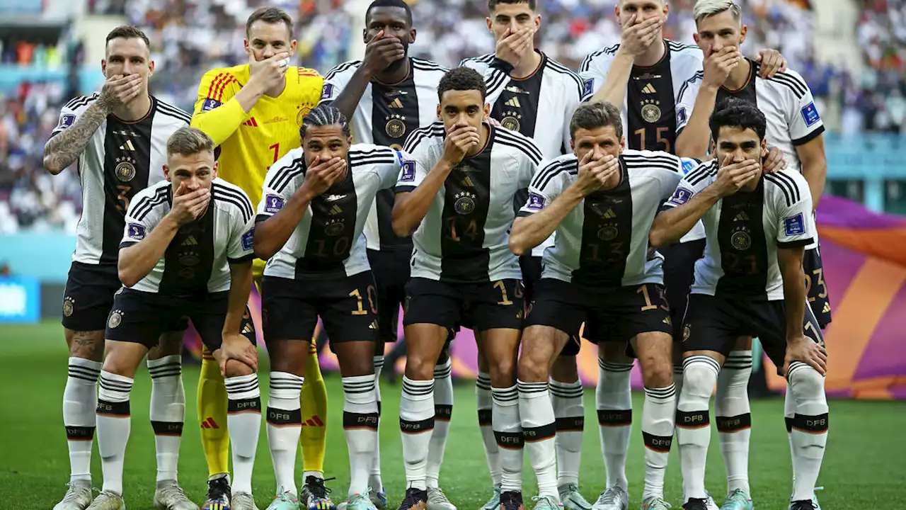 German players cover their mouths in Qatari stadium in protest over OneLove armbands