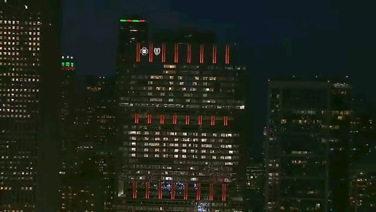 Meet the people who light up Chicago's skyline with messages on the Blue Cross Blue Shield building