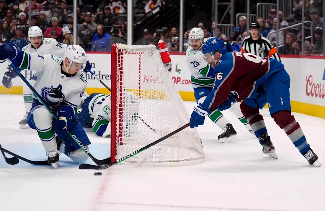 Avalanche blows third-period lead to Canucks; Evan Rodrigues injured