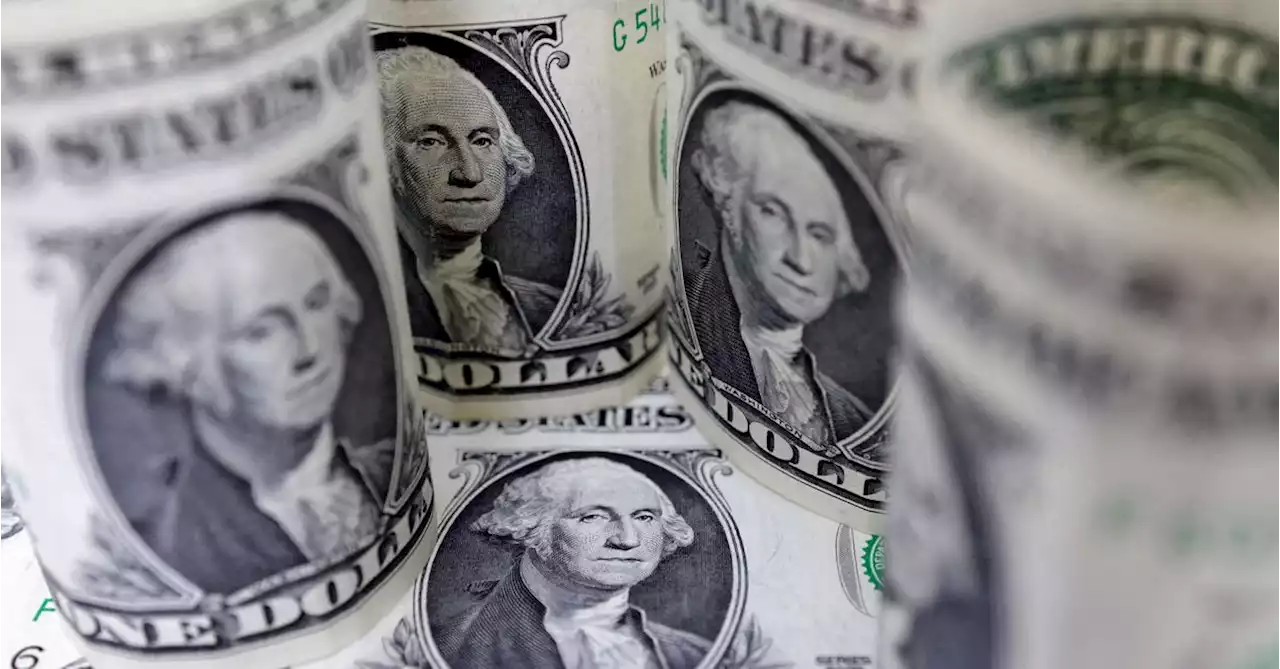 Dollar slips as risk sentiment improves after Fed minutes