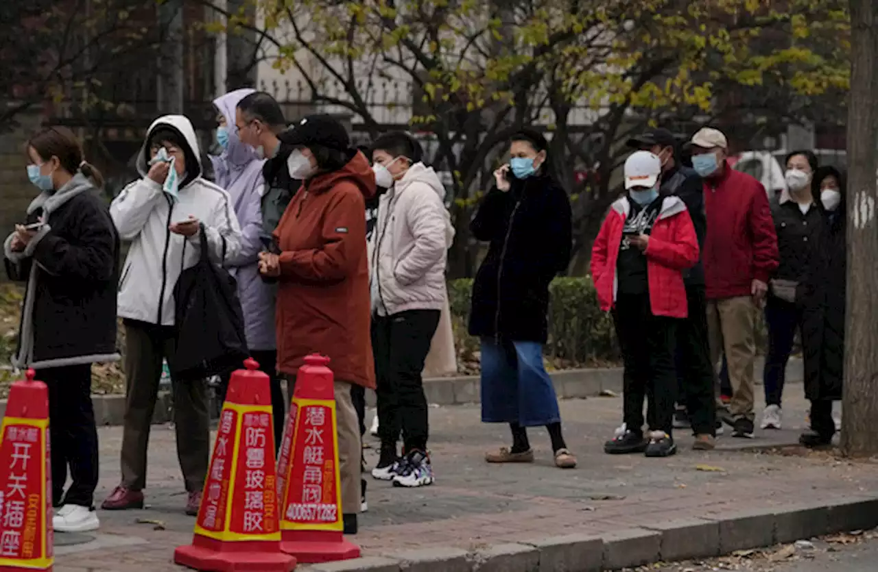 China expands lockdowns as Covid-19 cases hit daily record