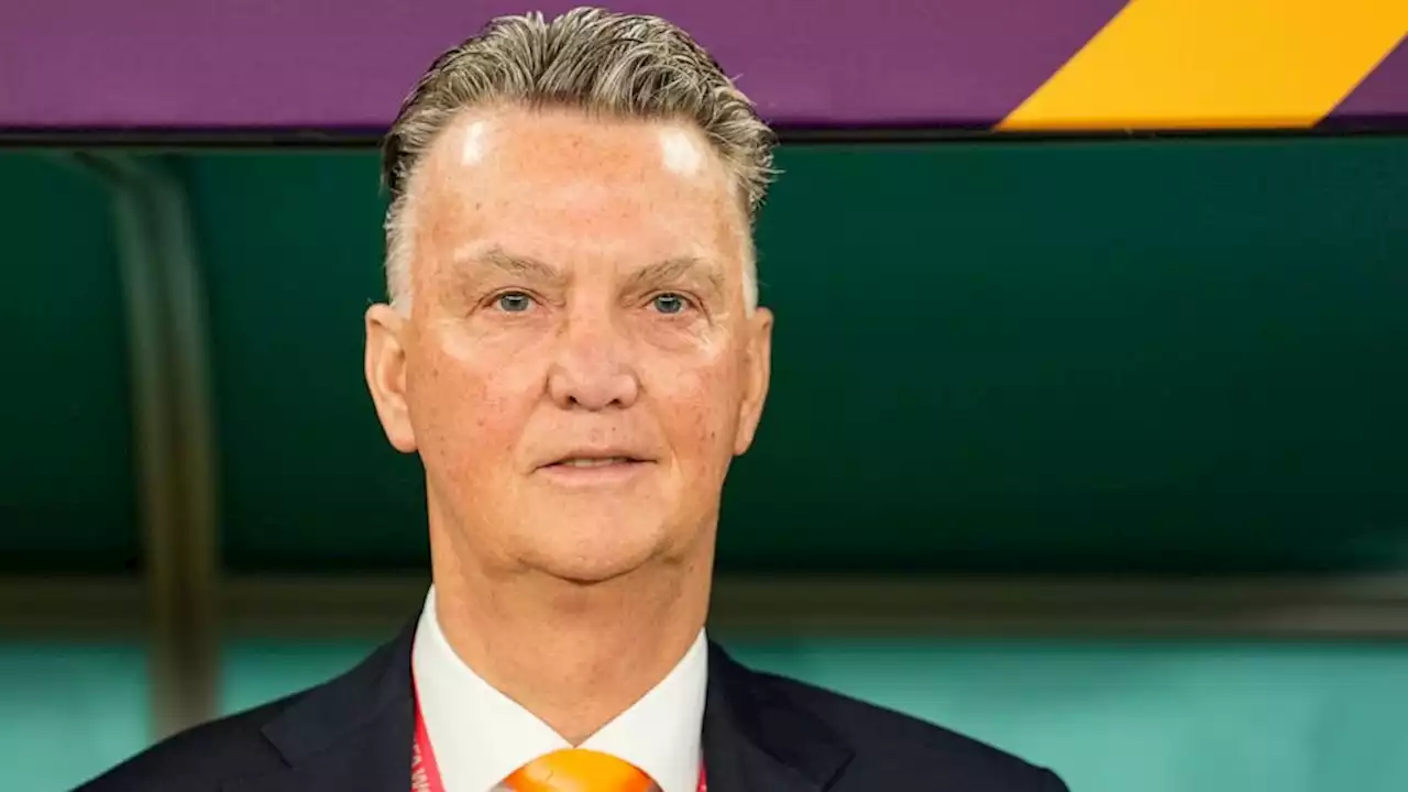 Netherlands coach Van Gaal hugs reporter at World Cup