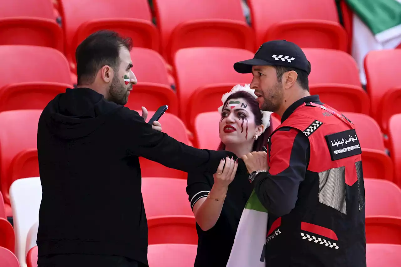 World Cup security staff confront woman over Mahsa Amini Iran shirt during Wales clash