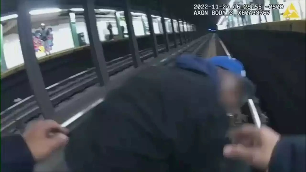 Video: Police officers, good Samaritan pull man from subway tracks as train nears station