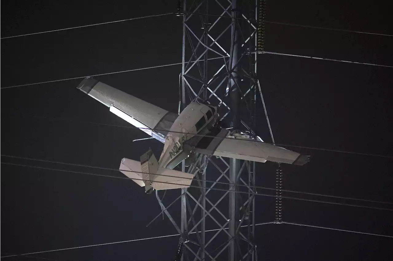 Crews rescue 2 from plane caught in power lines in Maryland