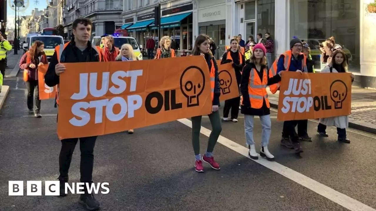 Just Stop Oil protesters slow traffic on the Strand in London