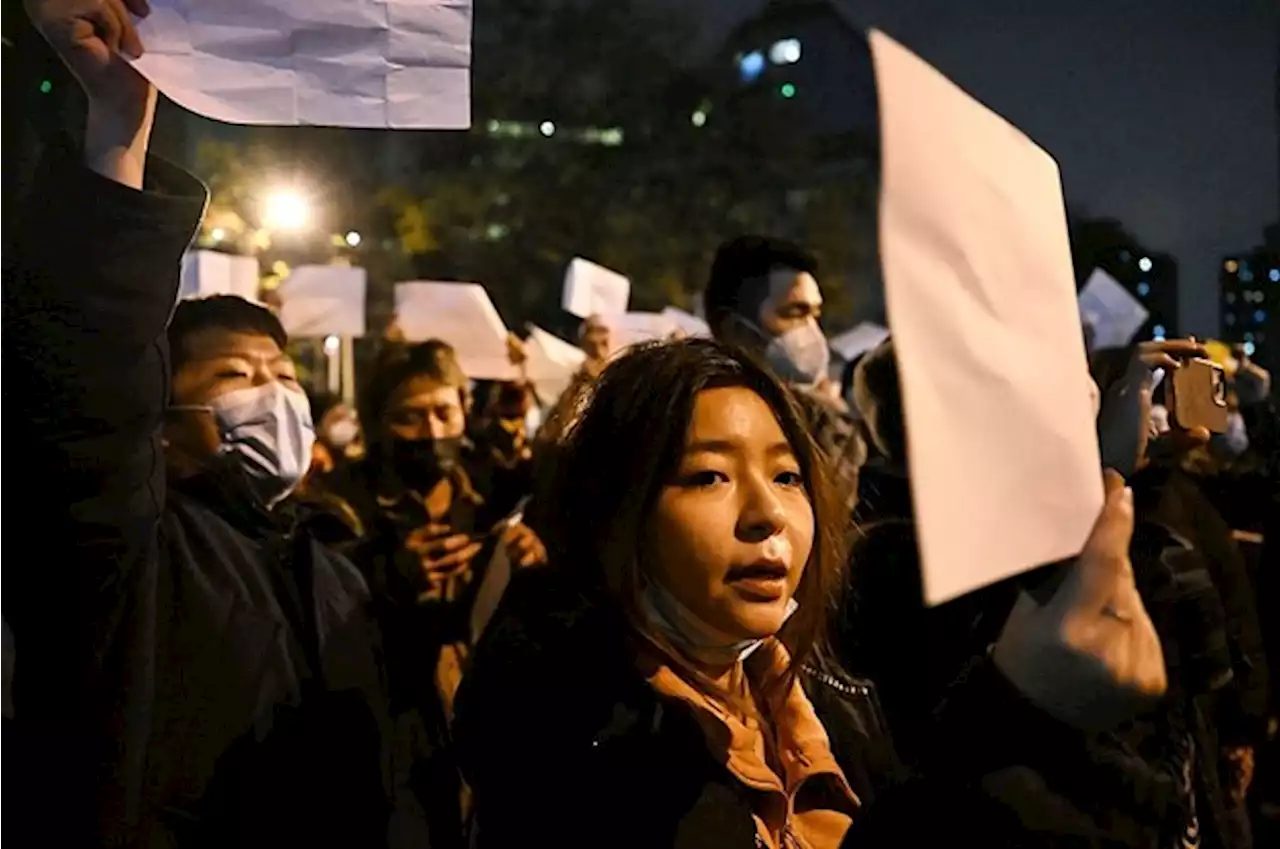 People In China Are Holding Blank Sheets Of Paper To Protest COVID Policies And Censorship