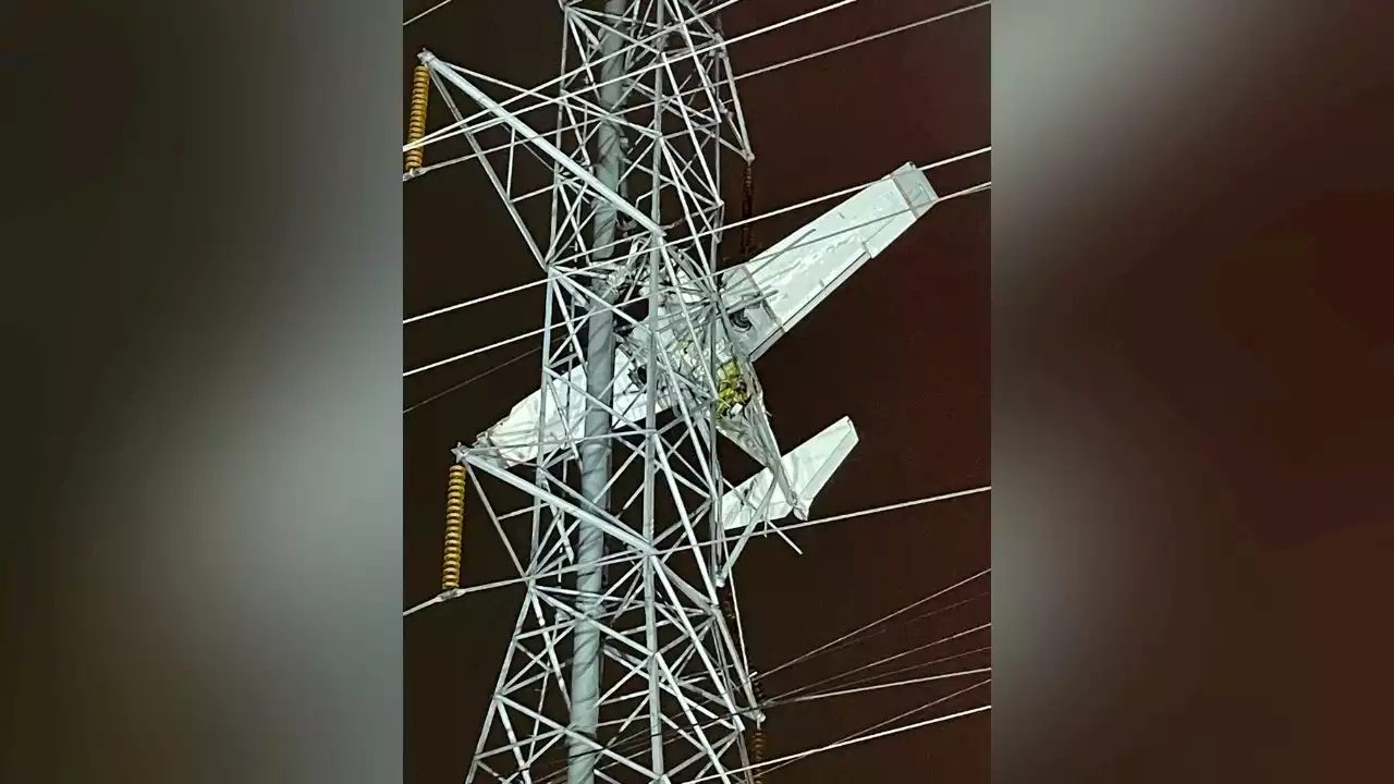 At least two people trapped in airplane stuck in live power lines in Maryland