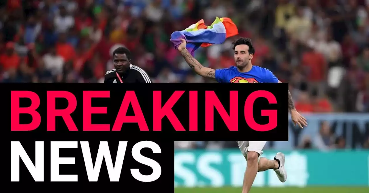 Pitch invader carrying Pride flag interrupts Portugal vs Uruguay clash