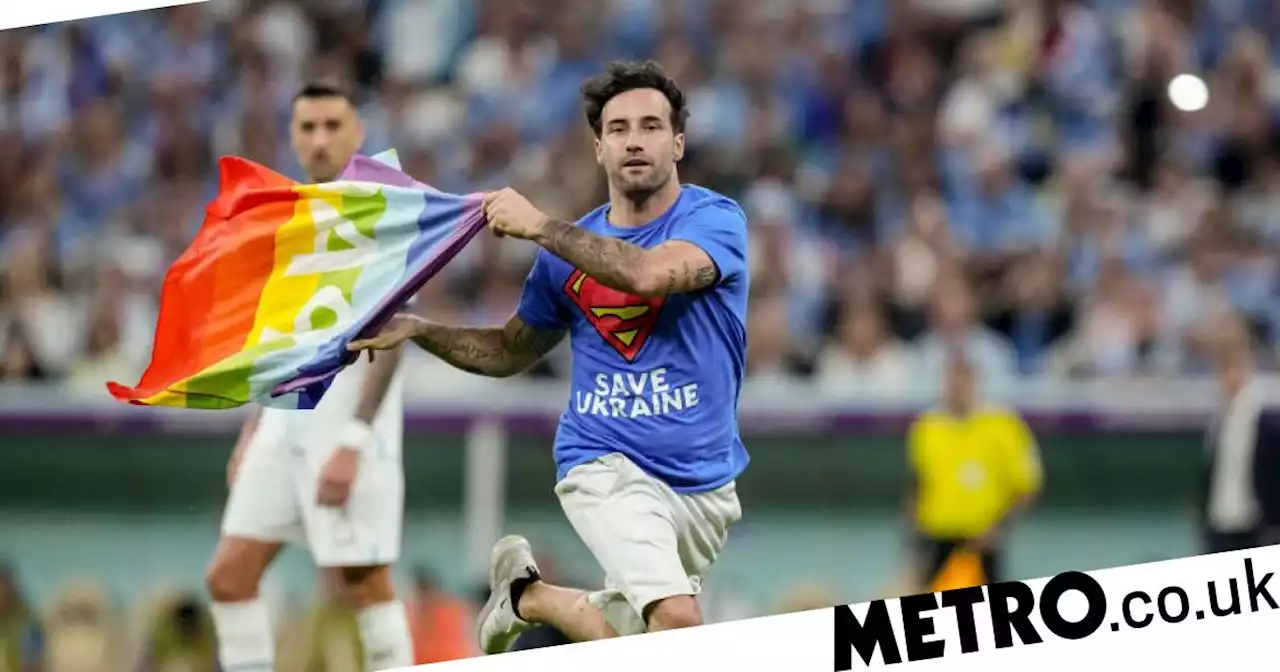 World Cup rainbow flag protester released but banned from attending matches