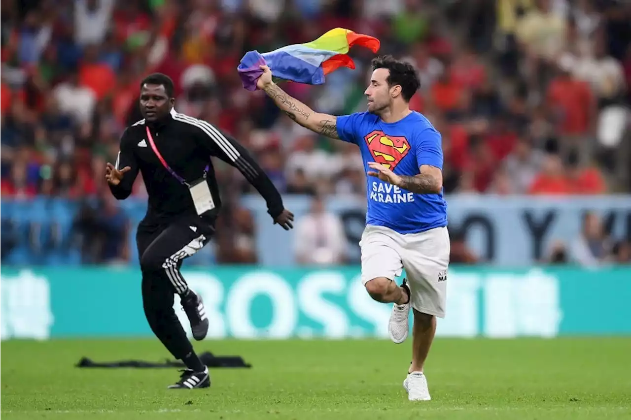 PICS | Man with rainbow flag invades pitch during Portugal-Uruguay World Cup game | Sport