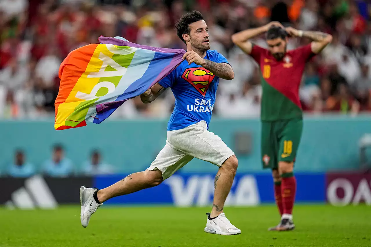 Protester crashes World Cup with rainbow flag, ‘Save Ukraine’ shirt