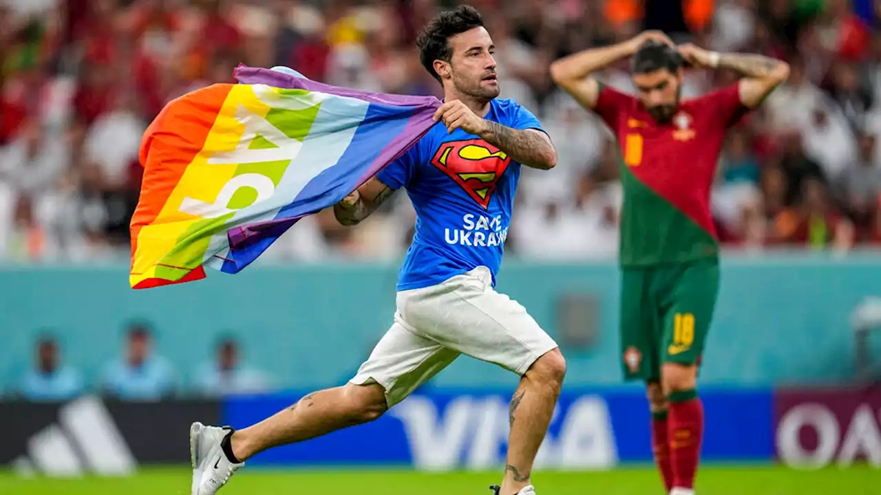 World Cup: Protester carrying rainbow flag invades pitch during game