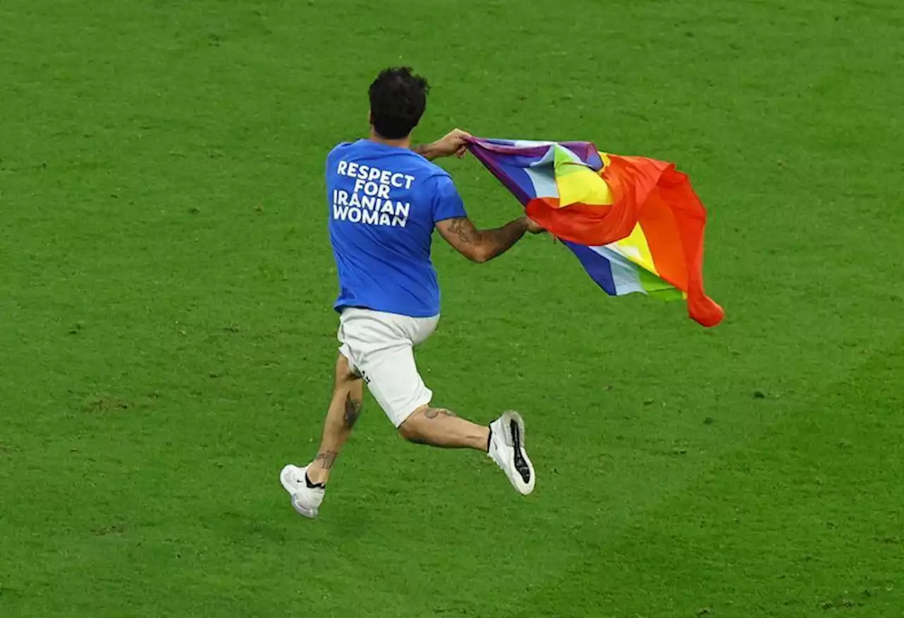 Soccer-Protester runs onto pitch during Portugal v Uruguay