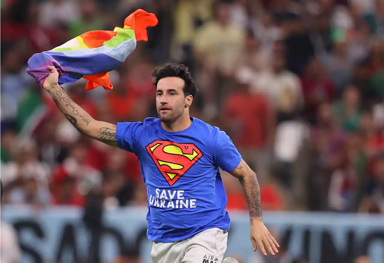 Pitch invader with rainbow flag halts Portugal v Uruguay wearing 'Save Ukraine' shirt