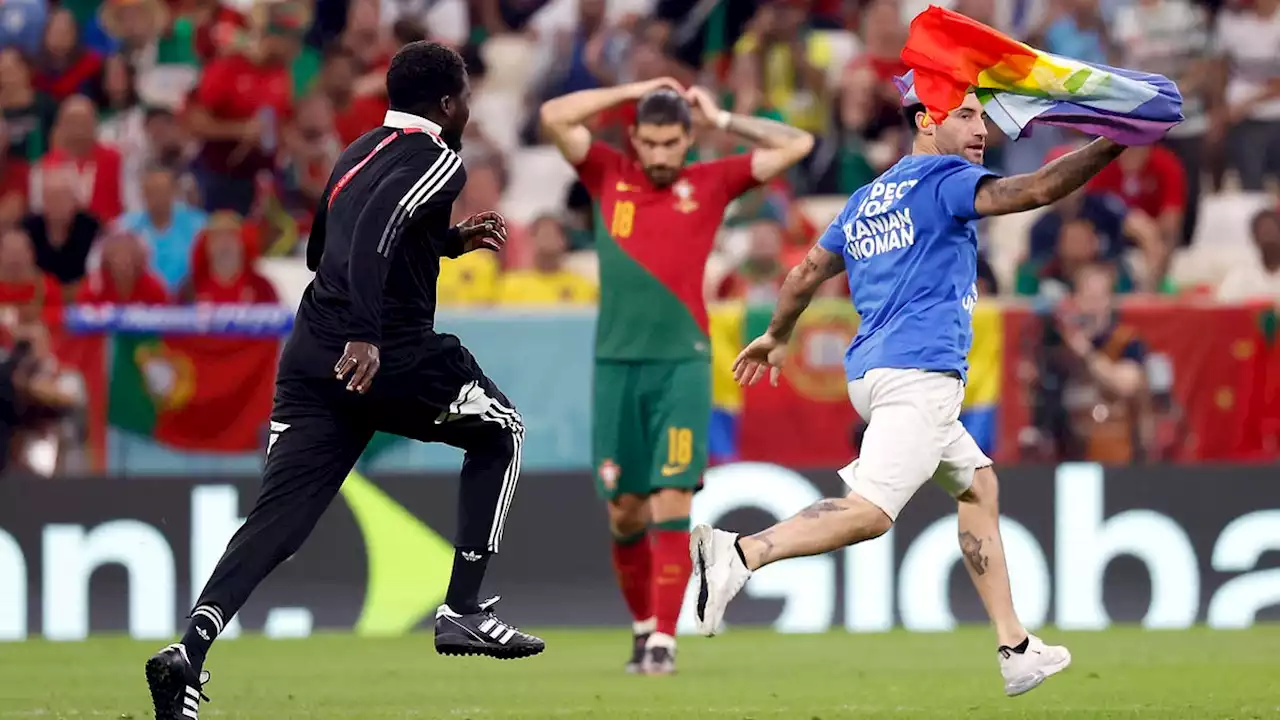 Protestor waving rainbow flag interrupts Portugal's world cup match against Uruguay