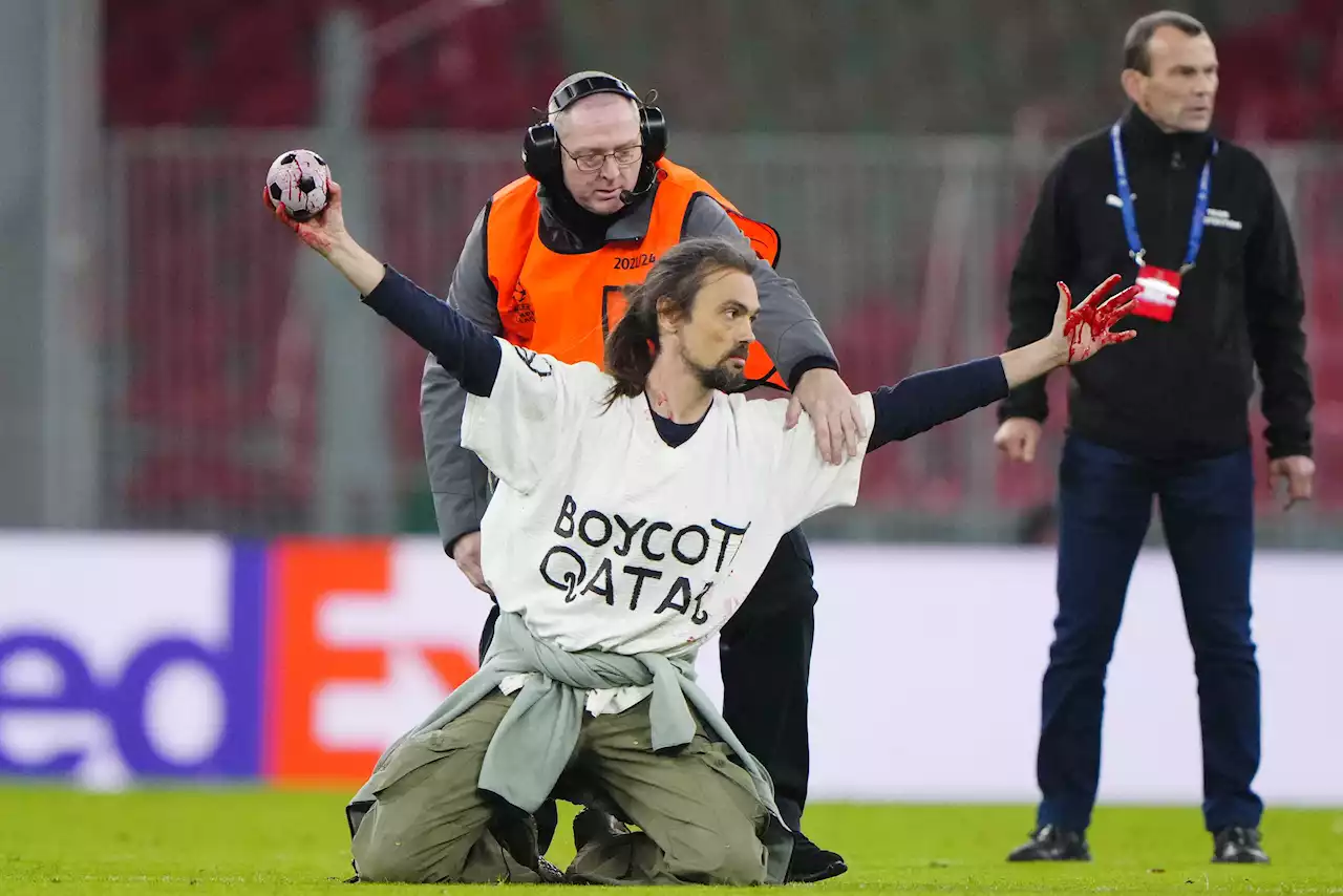 UCL clash stopped by Qatar World Cup protester running on pitch with fake blood