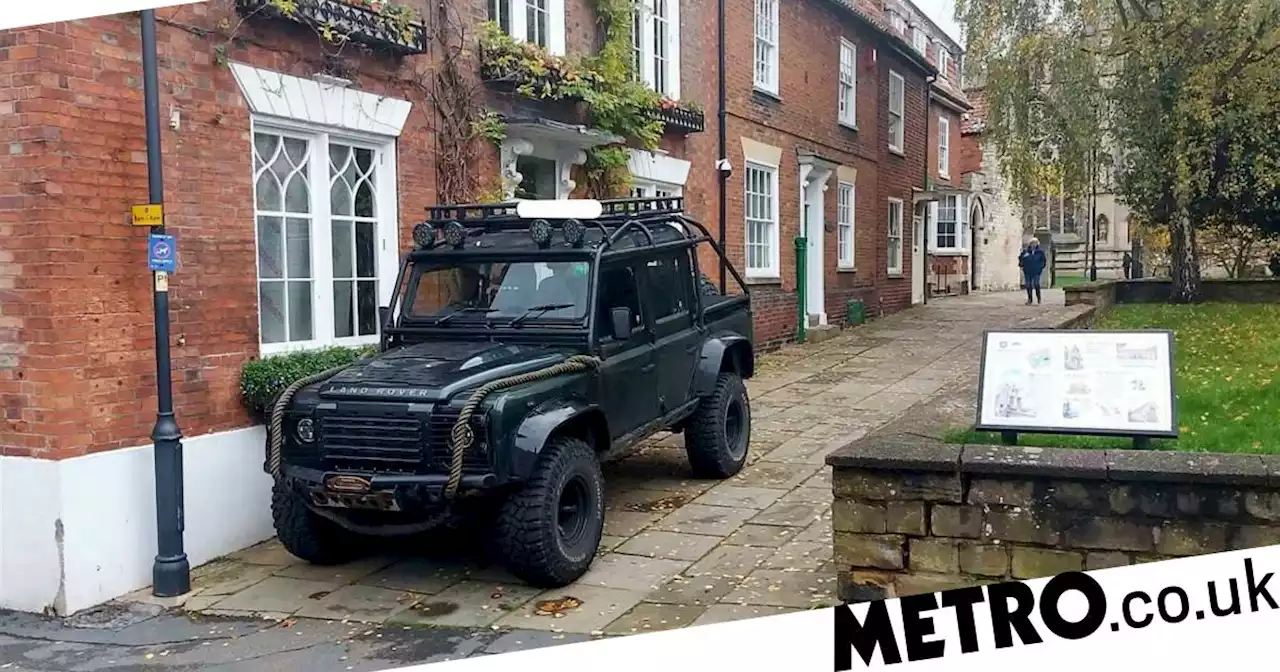 Man parks his Land Rover on church path to stop cars 'damaging' his house