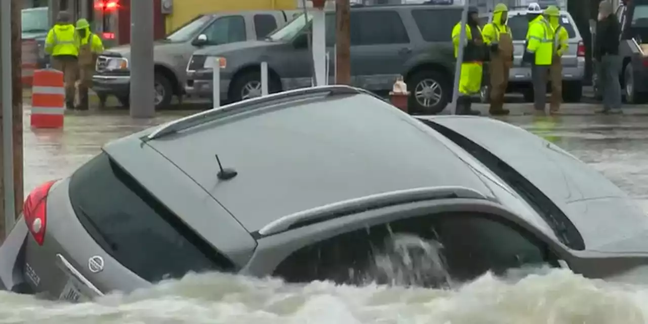 ‘Thank God for him’: City worker rescues family from vehicle caught in sinkhole