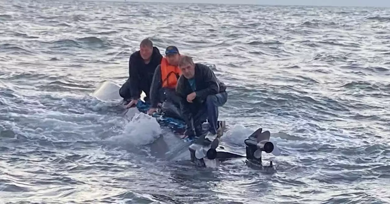 Coast Guard rescues 3 men spotted 'clinging' to hull of capsized boat off South Carolina