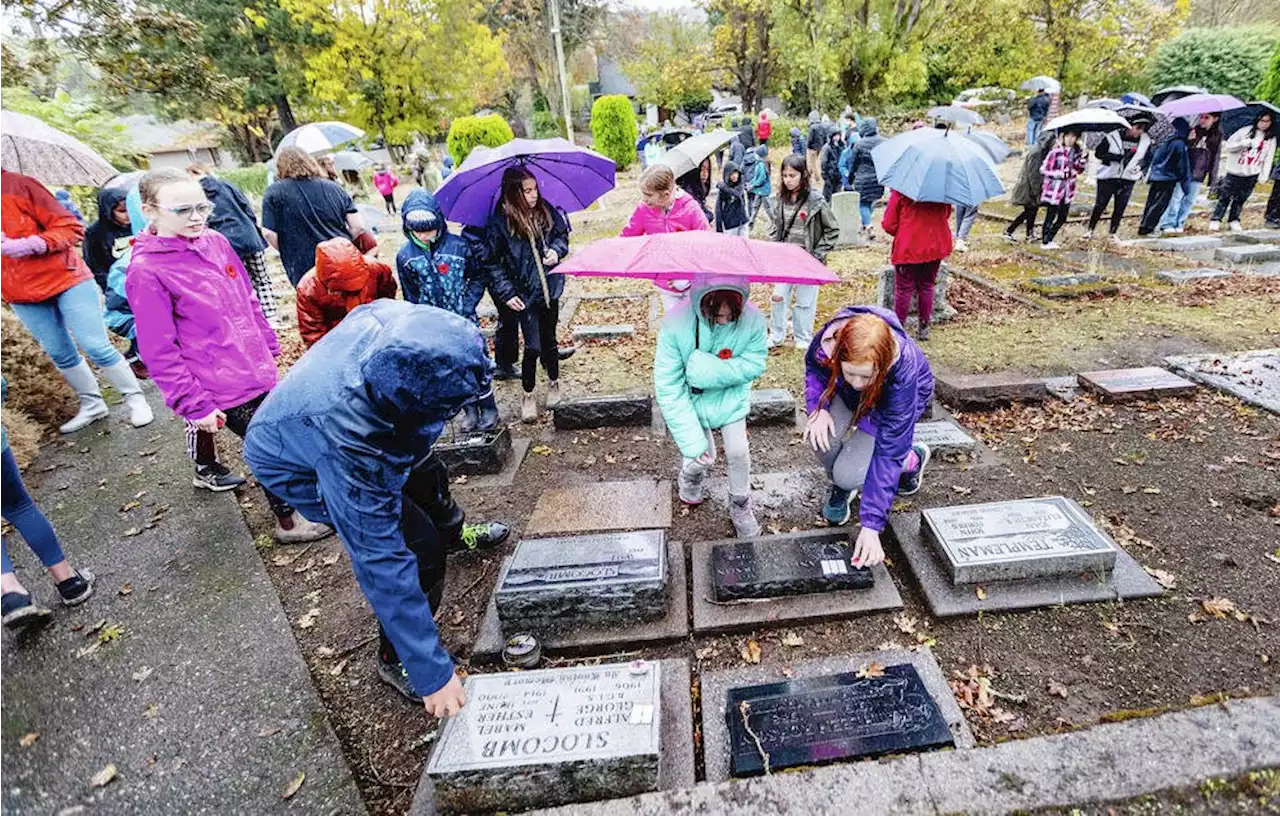 Students trek to cemeteries to honour veterans with poppy-painted stones