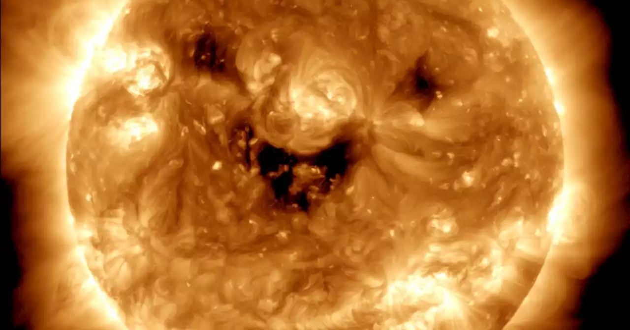 NASA caught the sun smiling down on us, but the grin could signal a solar storm