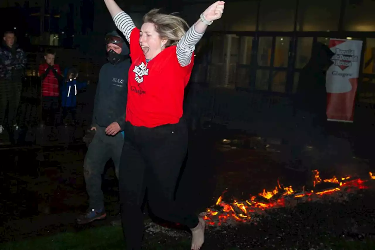 Brave fire-walkers step over burning hot coals for Glasgow charity