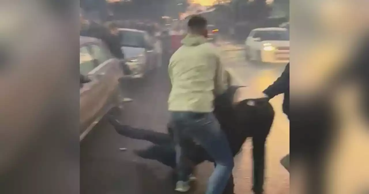 Football fans fight in chaotic scenes after Lancashire derby