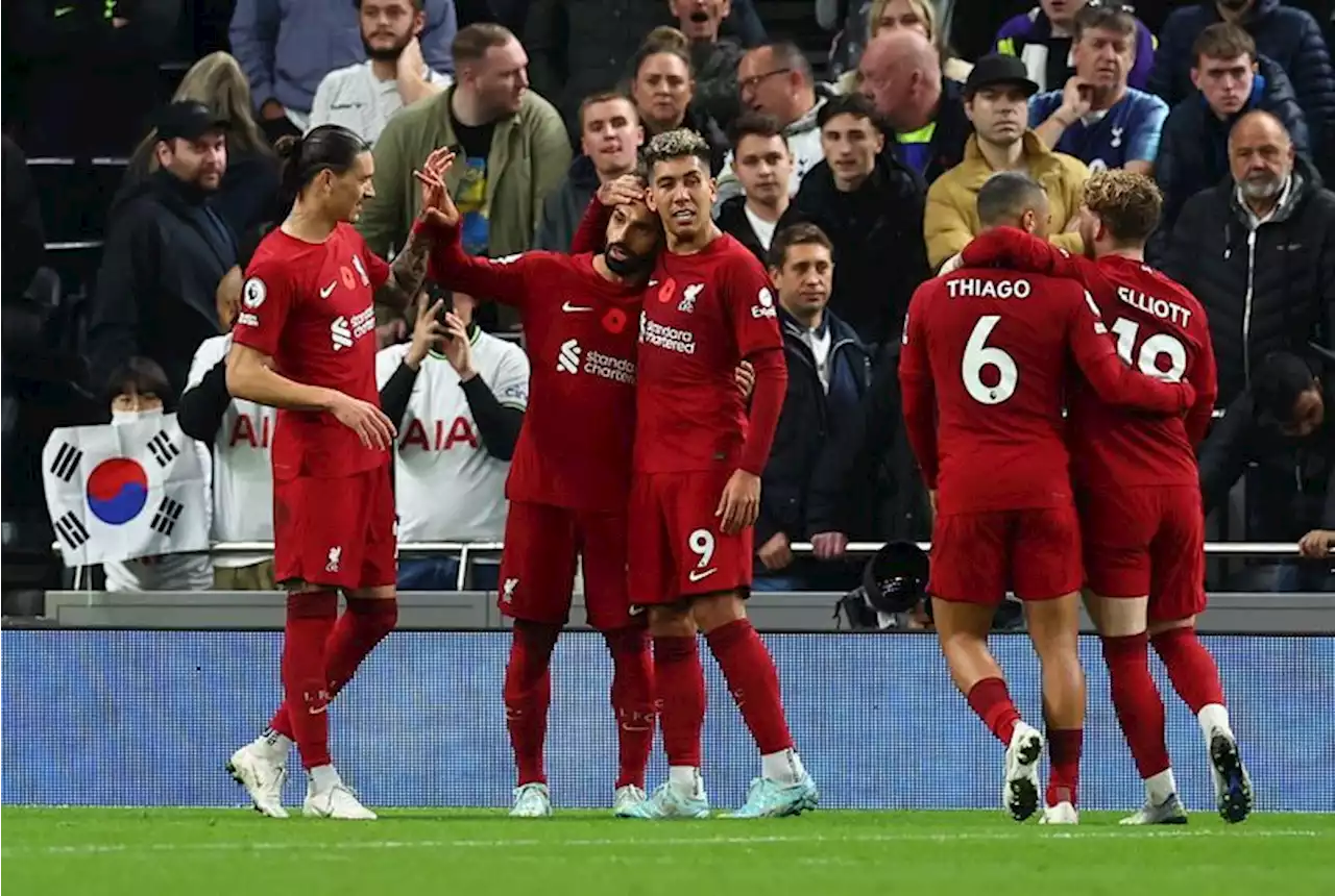 Soccer-Liverpool's Salah strikes twice to down battling Spurs