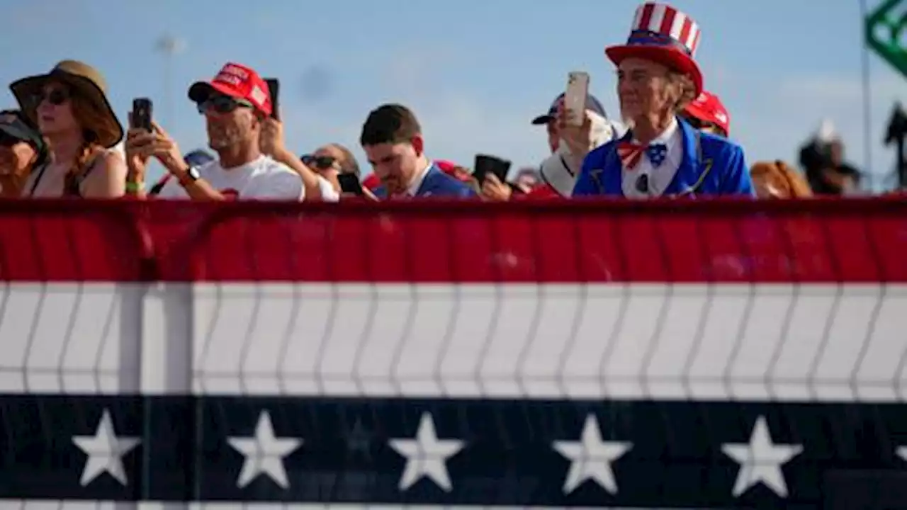 Trump tours for Republicans as Biden calls election 'defining moment'