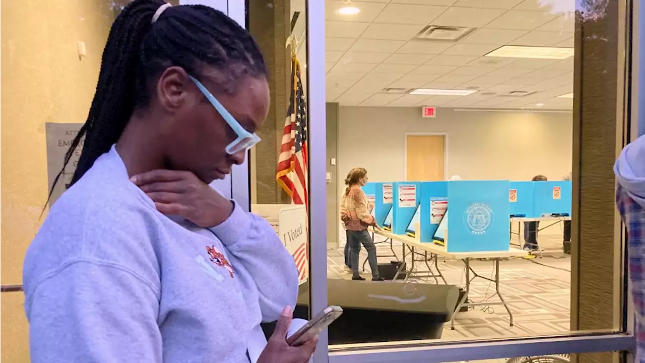 Early voters in Georgia show up in record numbers amid voting challenges