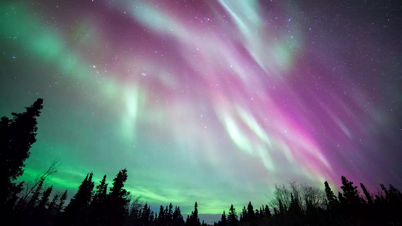 Solar storm 'smashes hole' in Earth's magnetic field producing bright pink light