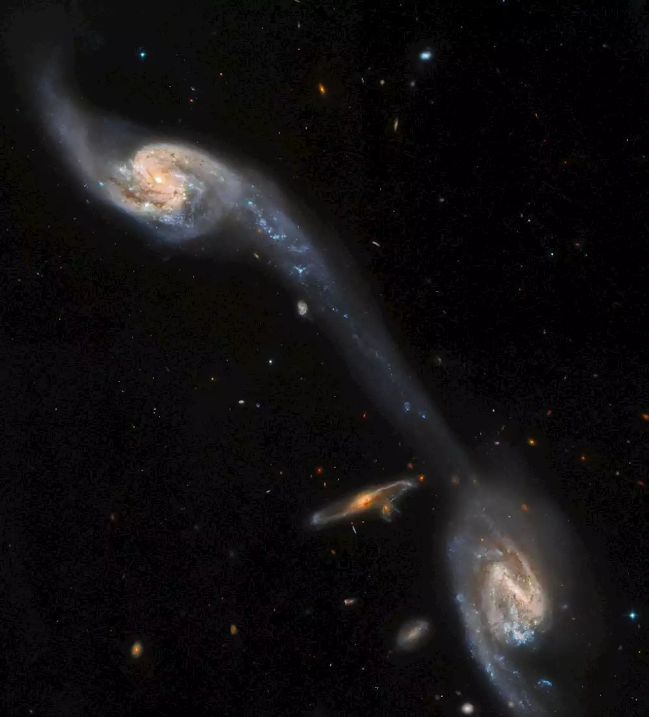 The Perfect Tidal Tail Connects These two Galaxies Seen by Hubble