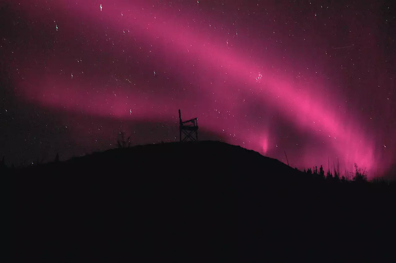 Dazzling photos show rare pink auroras in the sky after a solar storm