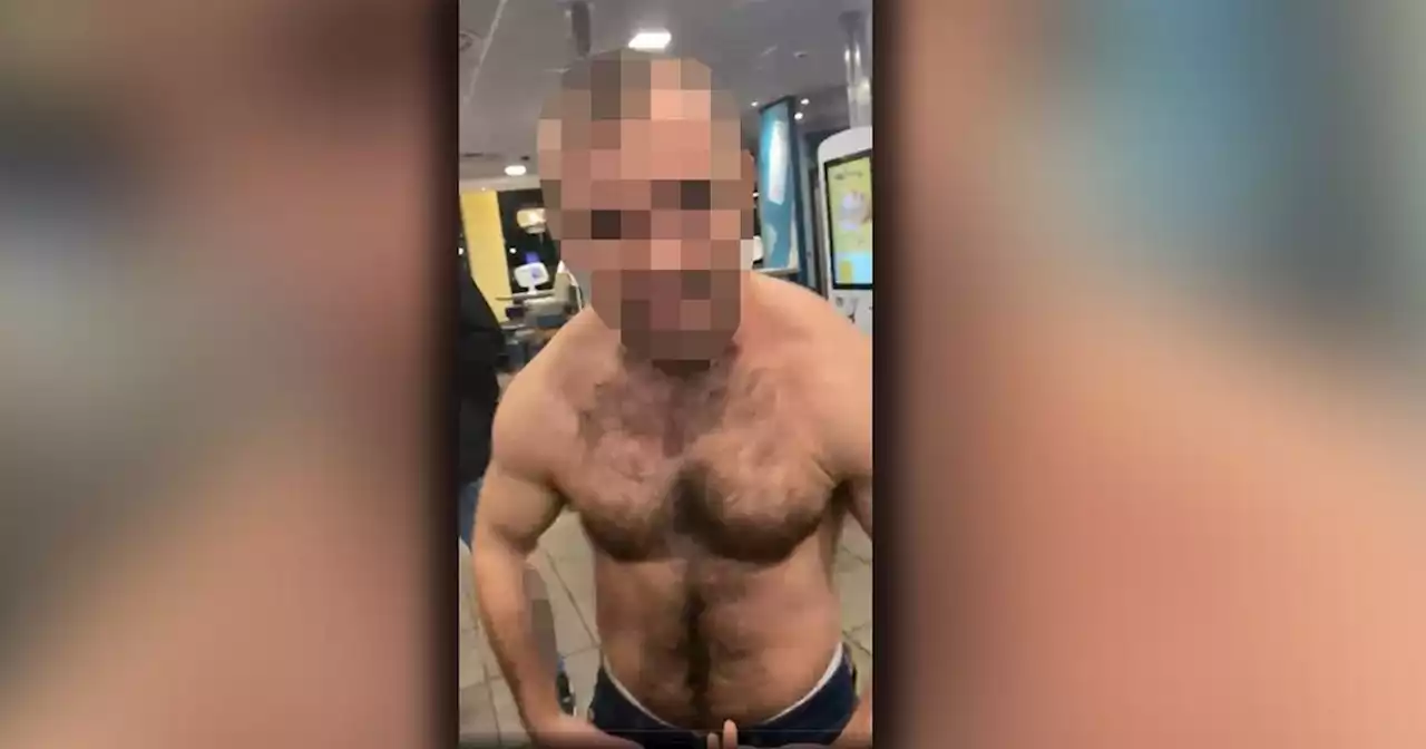 Thug ripped off shirt in McDonald's before launching racist abuse at customer