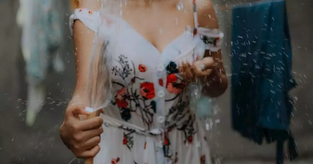 Woman 'in tears' as husband pours water on dress because it was 'too revealing'