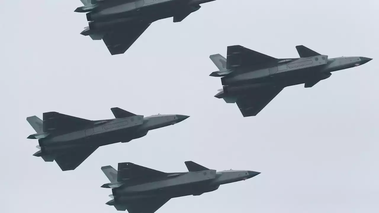 China shows off jets once shrouded in secrecy in clear display of military might