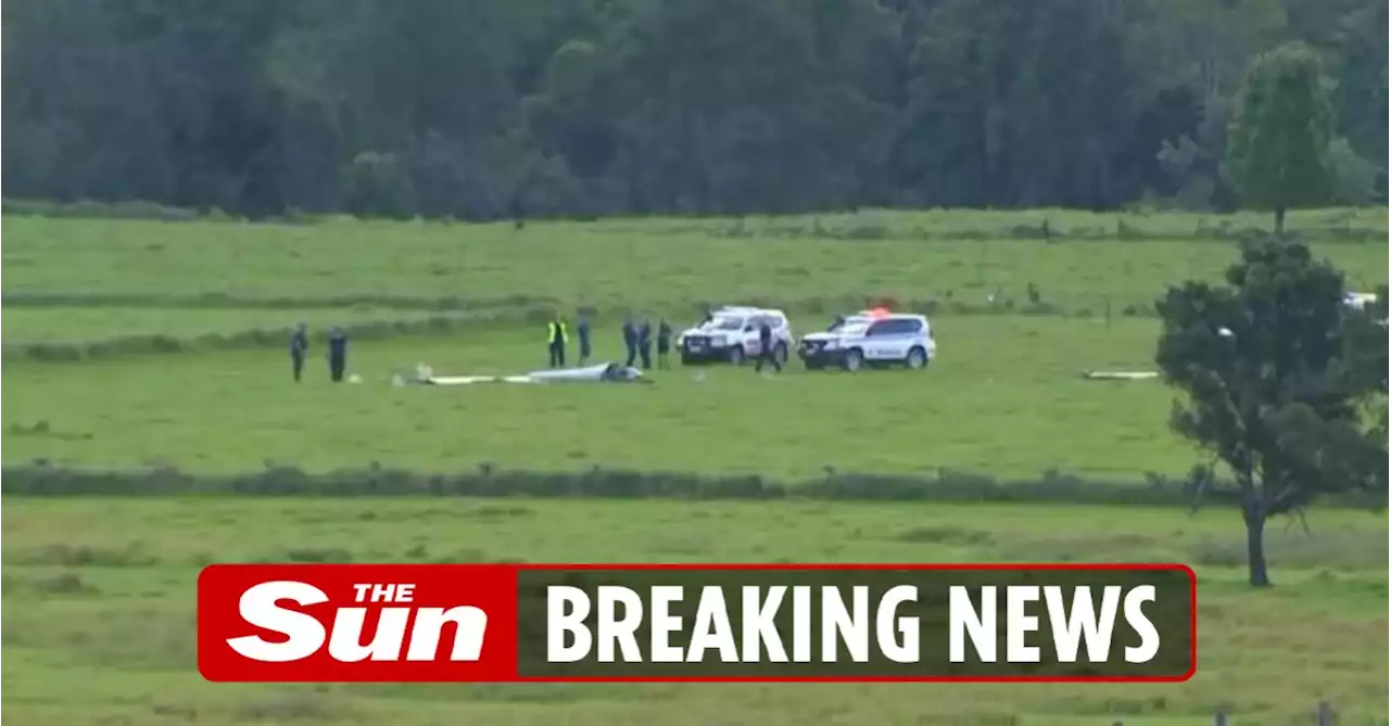 Two dead after double plane crash over farm as debris seen falling from sky