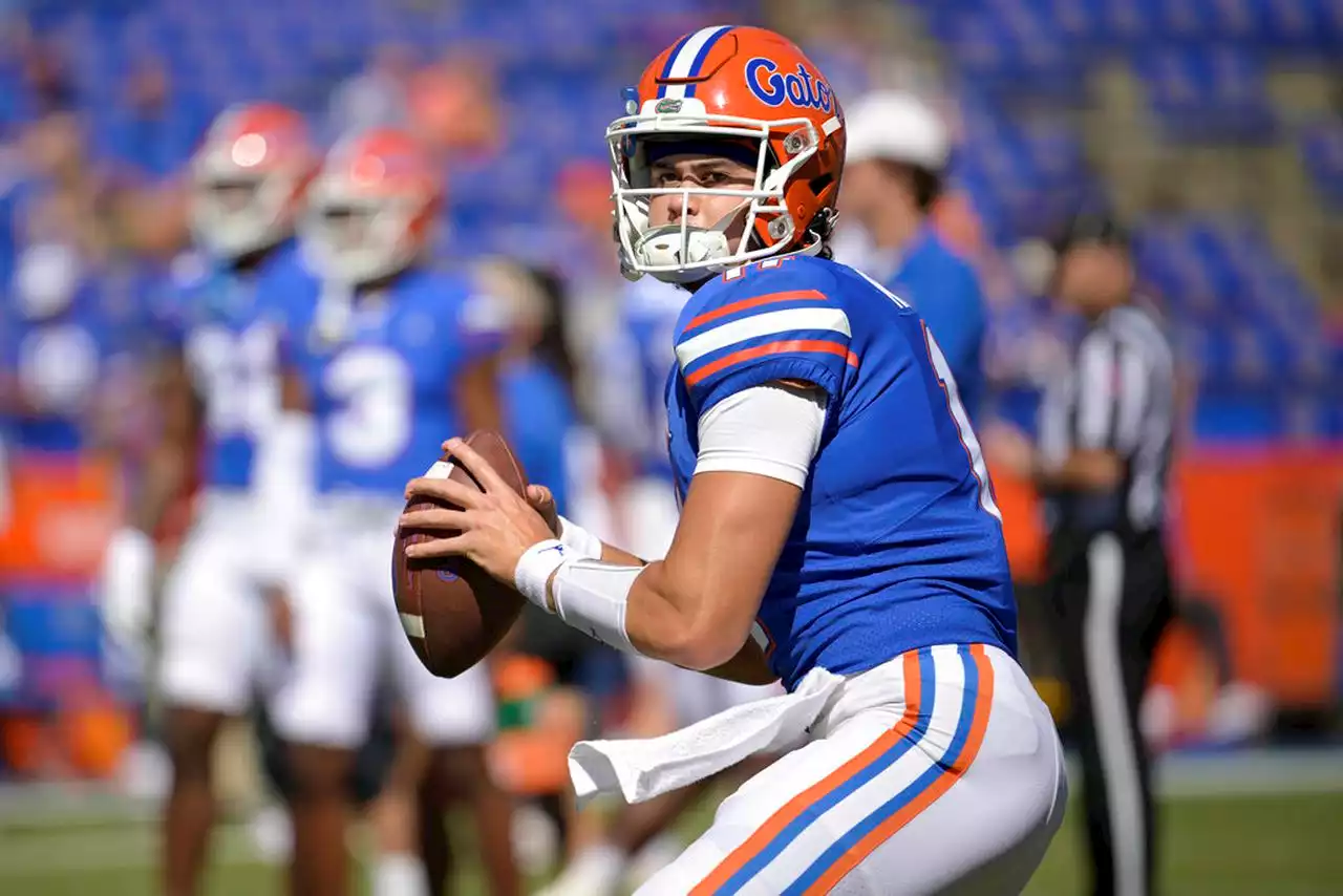 Florida QB Kitna charged with possessing child porn