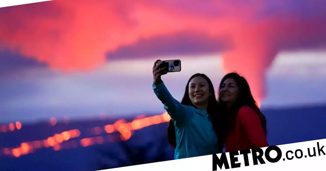 Thousands flock to world's largest volcano for a selfie during eruption