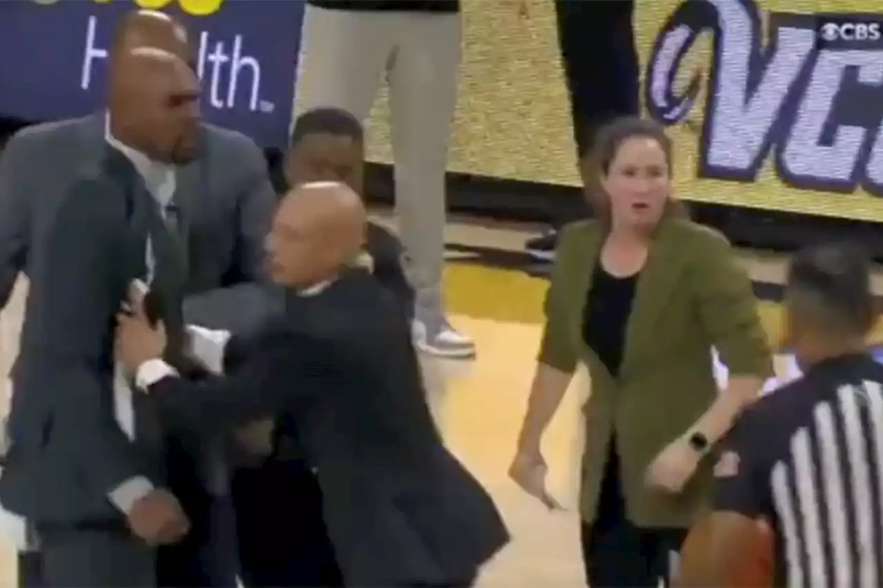 Vanderbilt coach Jerry Stackhouse restrained by security during heated ejection