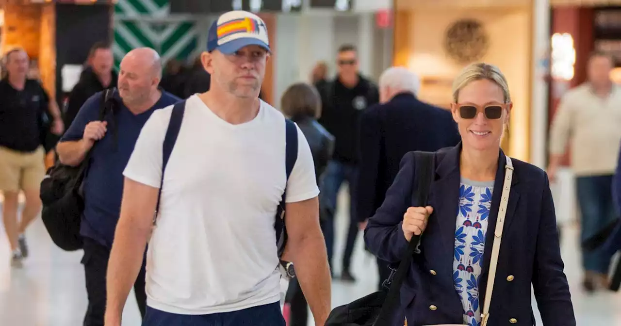 Humble royals! Mike and Zara Tindall carry their own luggage through Oz airport