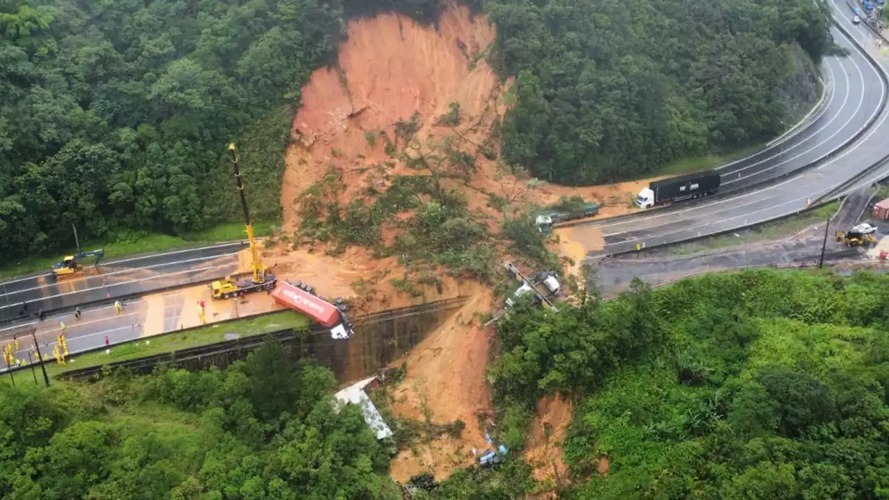 At least two dead and dozens missing after landslide engulfs motorway in Brazil