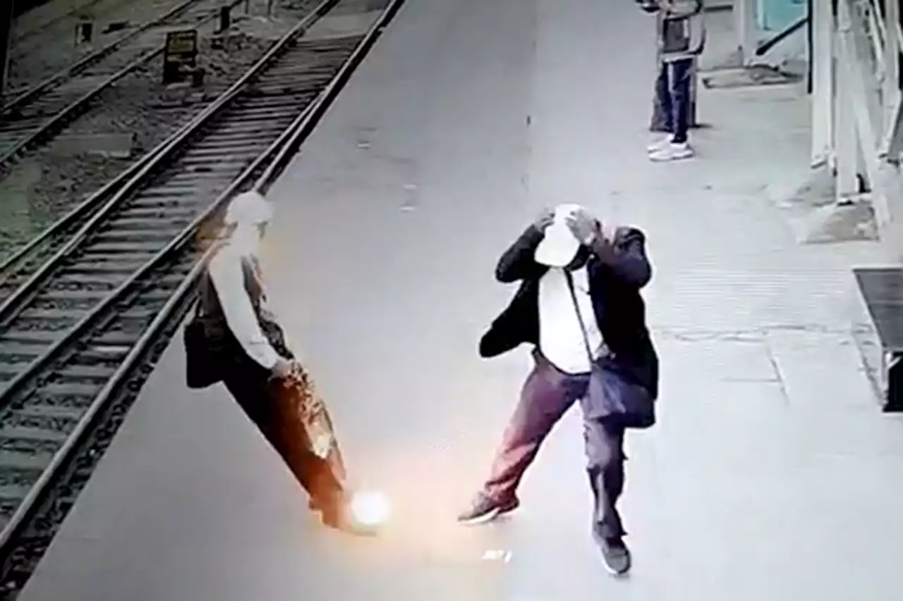 Shocking moment man is zapped by falling power line on train platform