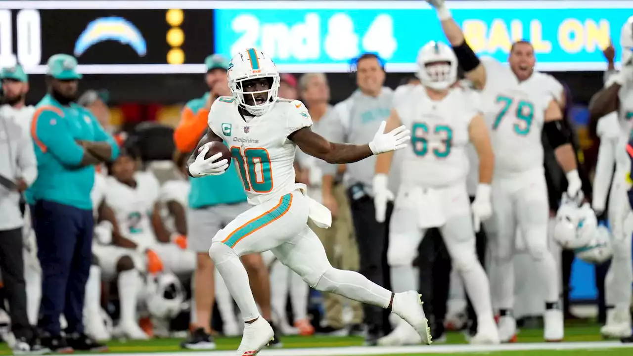 Dolphins WR Tyreek Hill scores a zany touchdown on fumble recovery for 57 yards