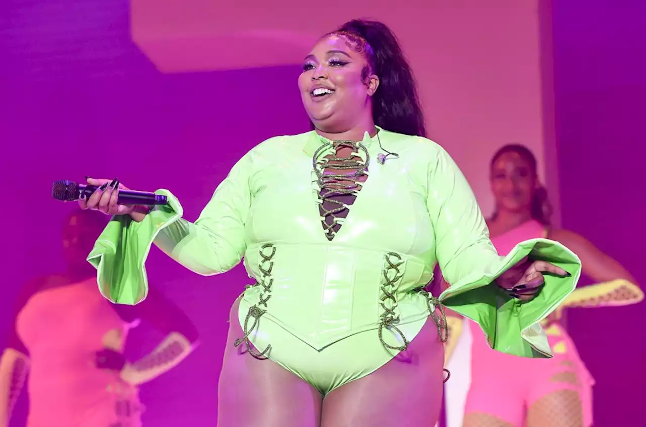 Lizzo Is ‘100% That Grinch’ in Festive Bondage Outfit