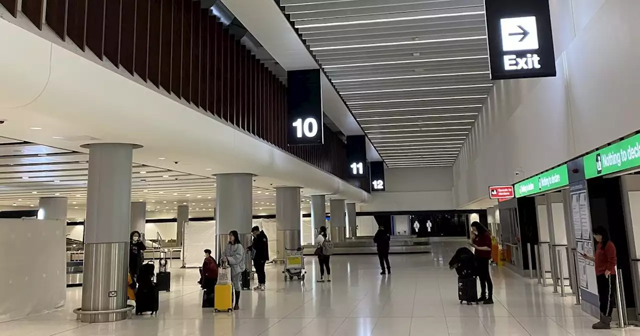 Passengers faced with SIX HOUR baggage wait as cold snap hits Manchester Airport